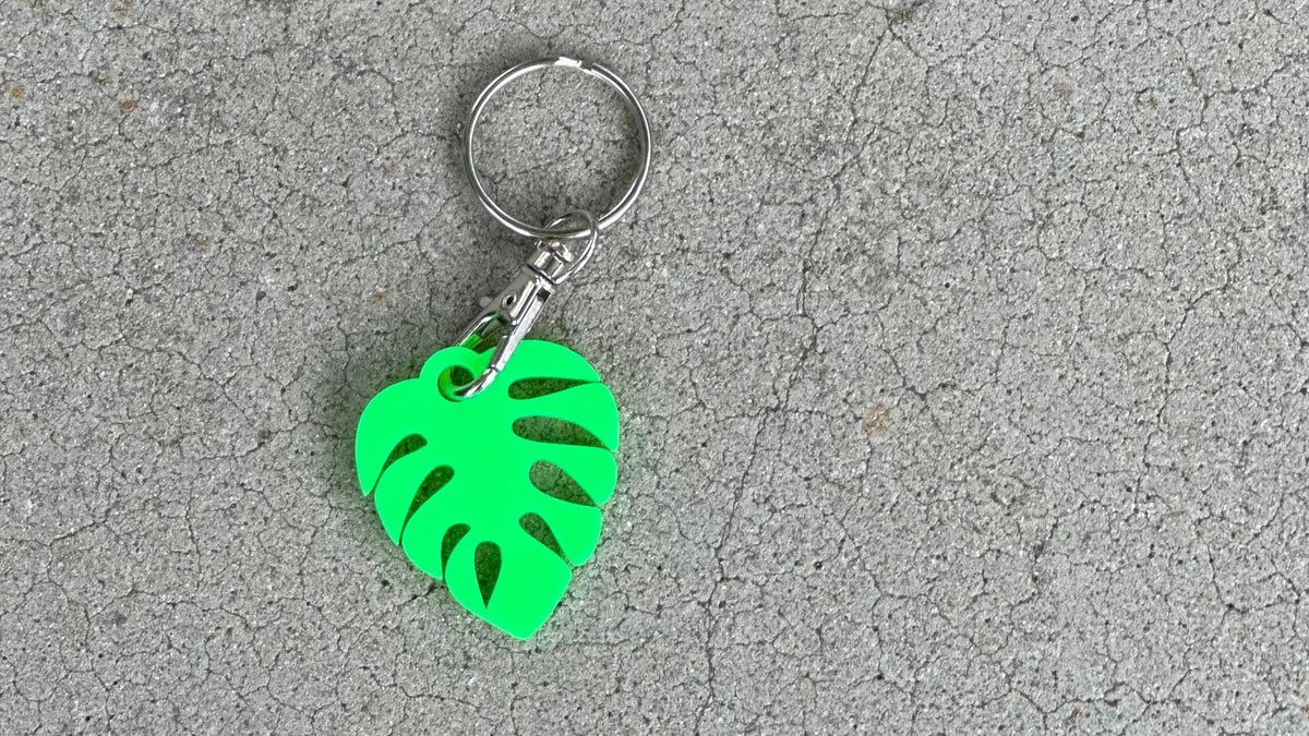 Cute personalized small monstera leaf in bright green with a lobster claw keychain matte side.