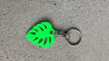 Cute personalized small monstera leaf in bright green with a lobster claw keychain matte side.